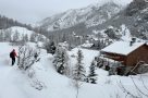 Snowshoeing into a village along the Claree Valley