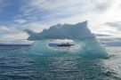 M/S Expedition seen through an iceberg formation