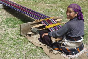 Weaving using a traditional backstrap loom