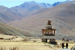 Trekking past gompa at Dho Tarap