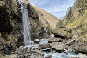 Suspension bridge and waterfall in Miristi Khola Canyon