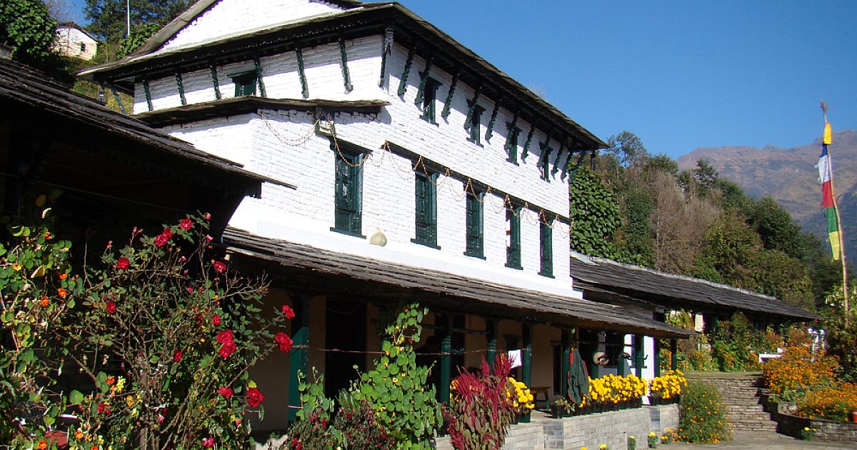 Landscape image of mountains & fields with sunset