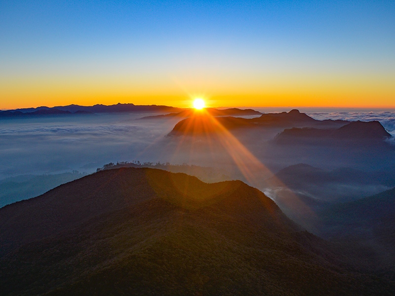 Watch sunrise from the summit of Adam's Peak
